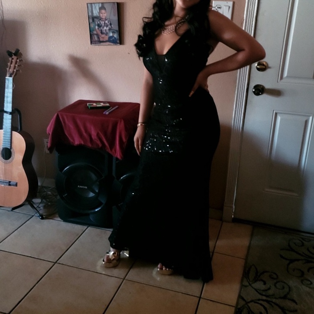 Black long dress , sequins, lace , deep v in chest, slightly longer in back.